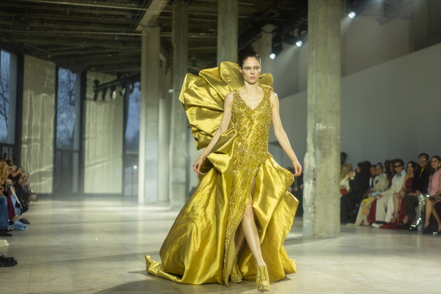 Coco Rocha concluded the show in a gorgeous gold dress. Image 1