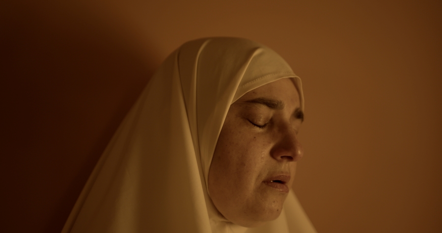 Hiba Khodr cries during prayer . Image 1